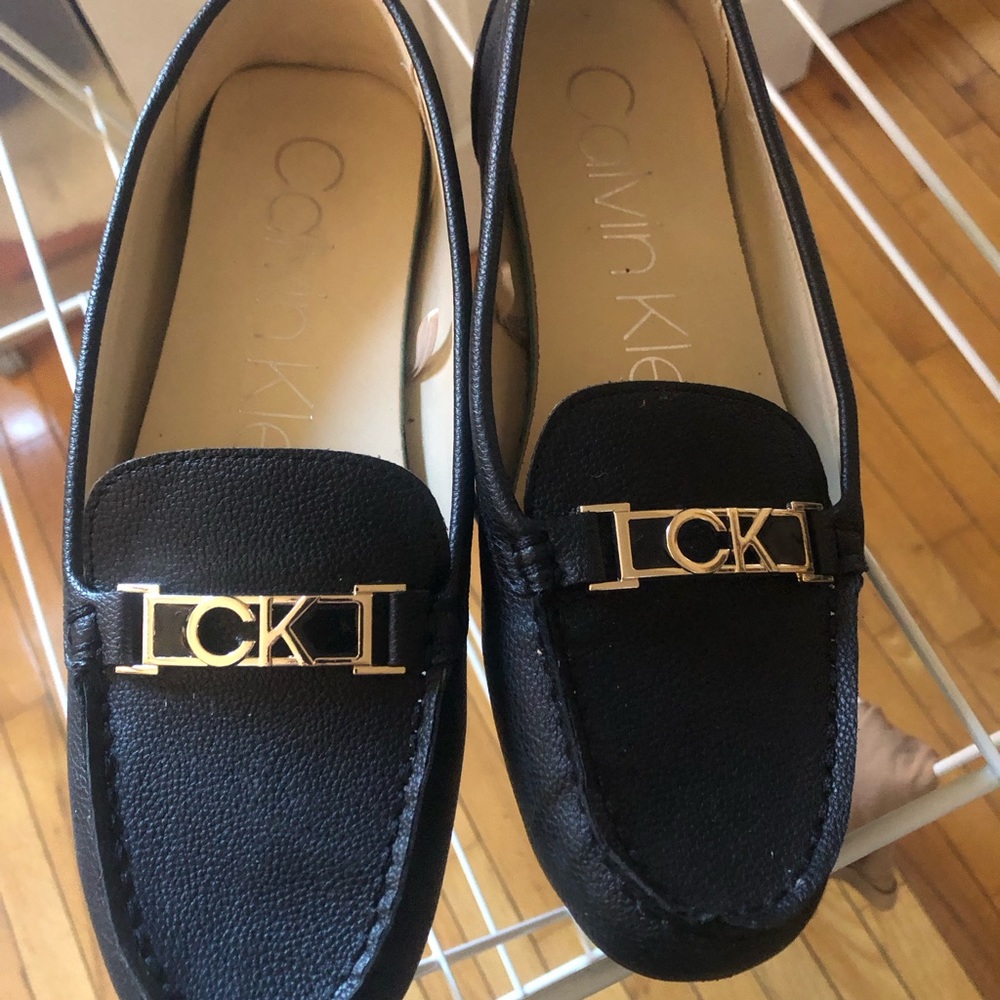 Calvin Klein Lacy flats size 8m almost new only worn once …mostly inside.